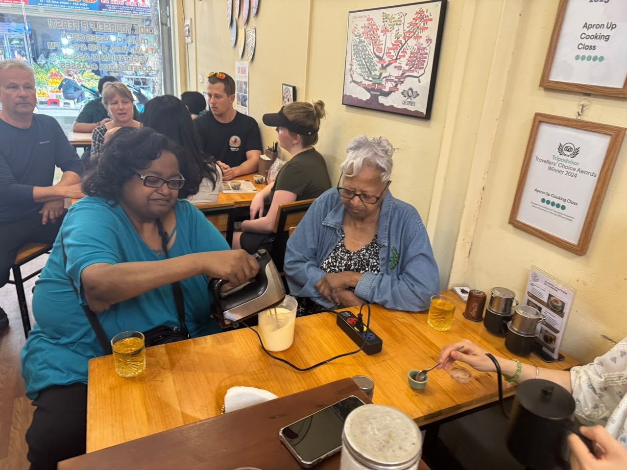 Students learning to make Vietnamese coffee
