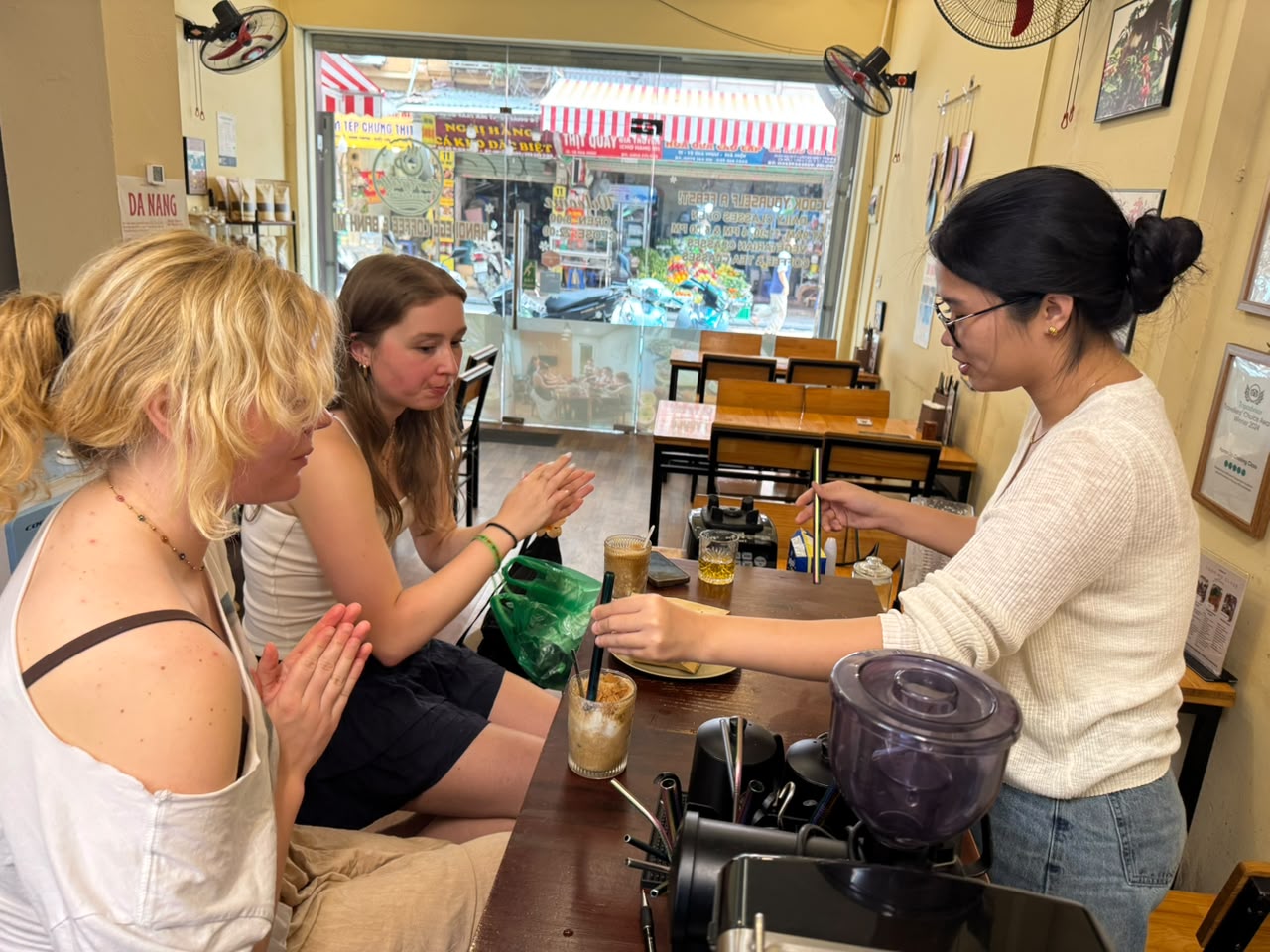 Barista preparing iced coffee for guests